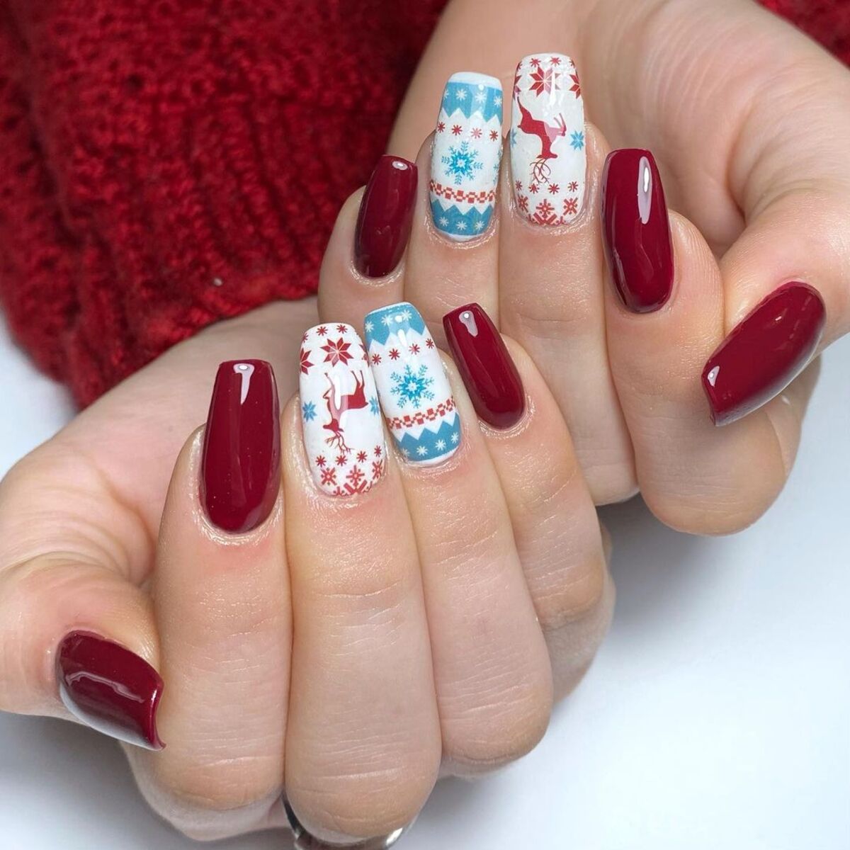 29. Nordic Sweater-Inspired Nails with Festive Patterns