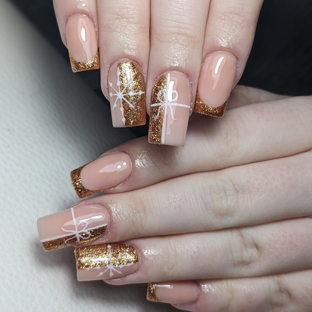 10. Classic French Tips with Gold Gift Wrap Accents