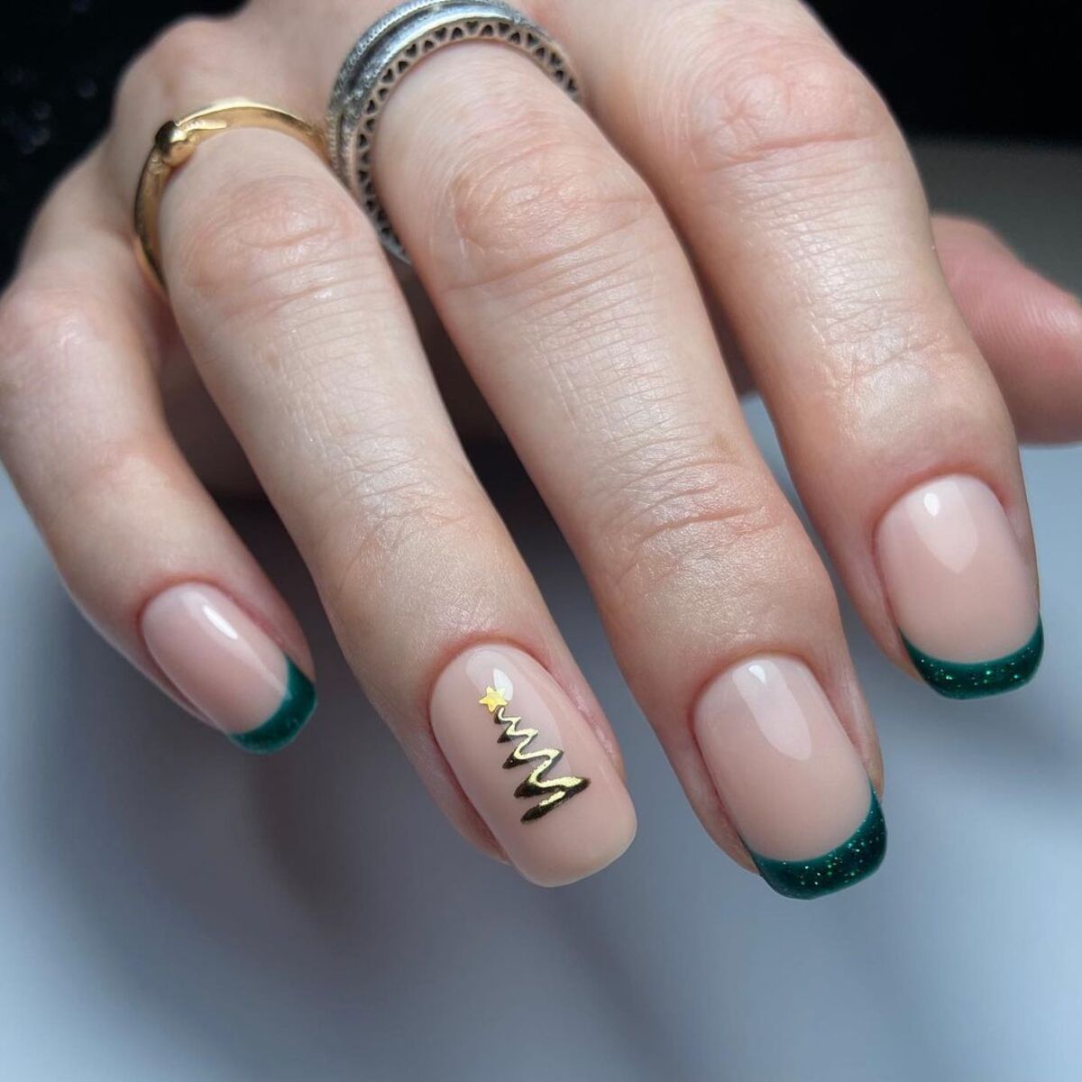 1. Classic Green French Tips with Golden Christmas Tree Accent