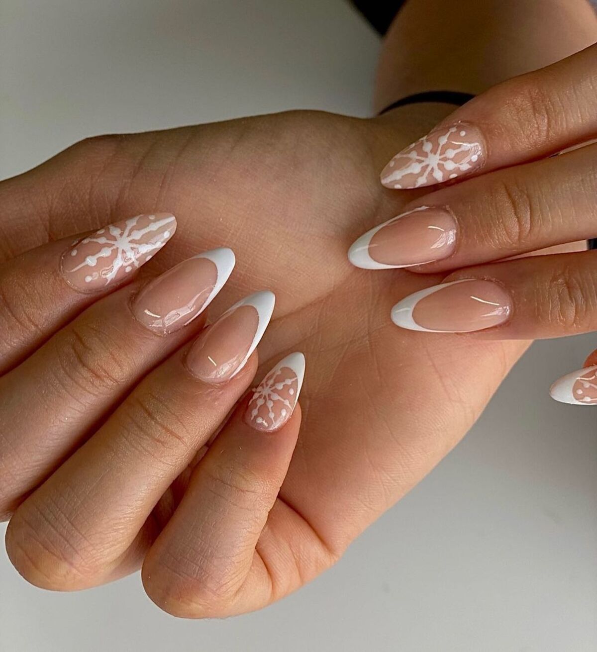 12. French Tips with Delicate Snowflake Detail