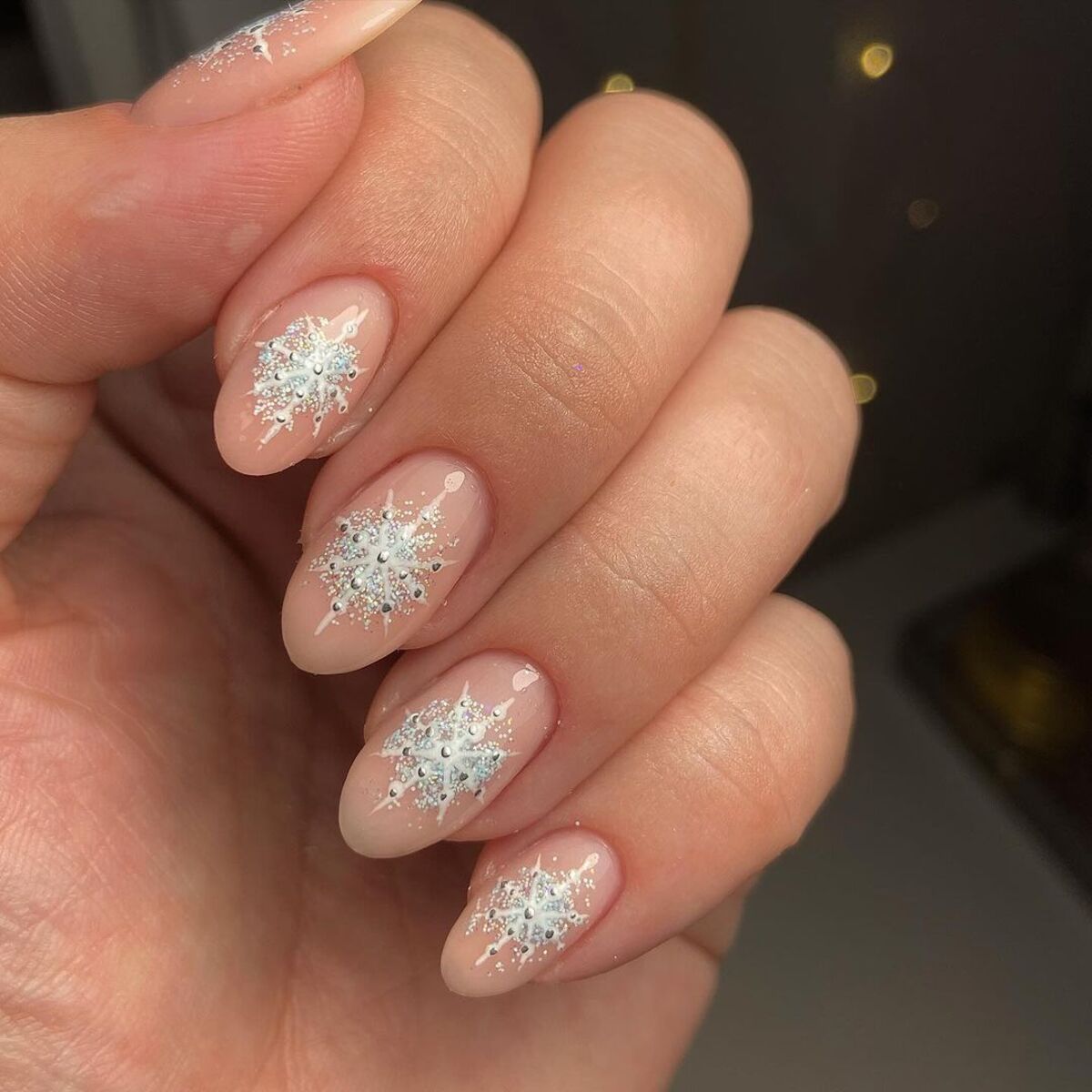 17. Icy White Snowflake Glitter Nails