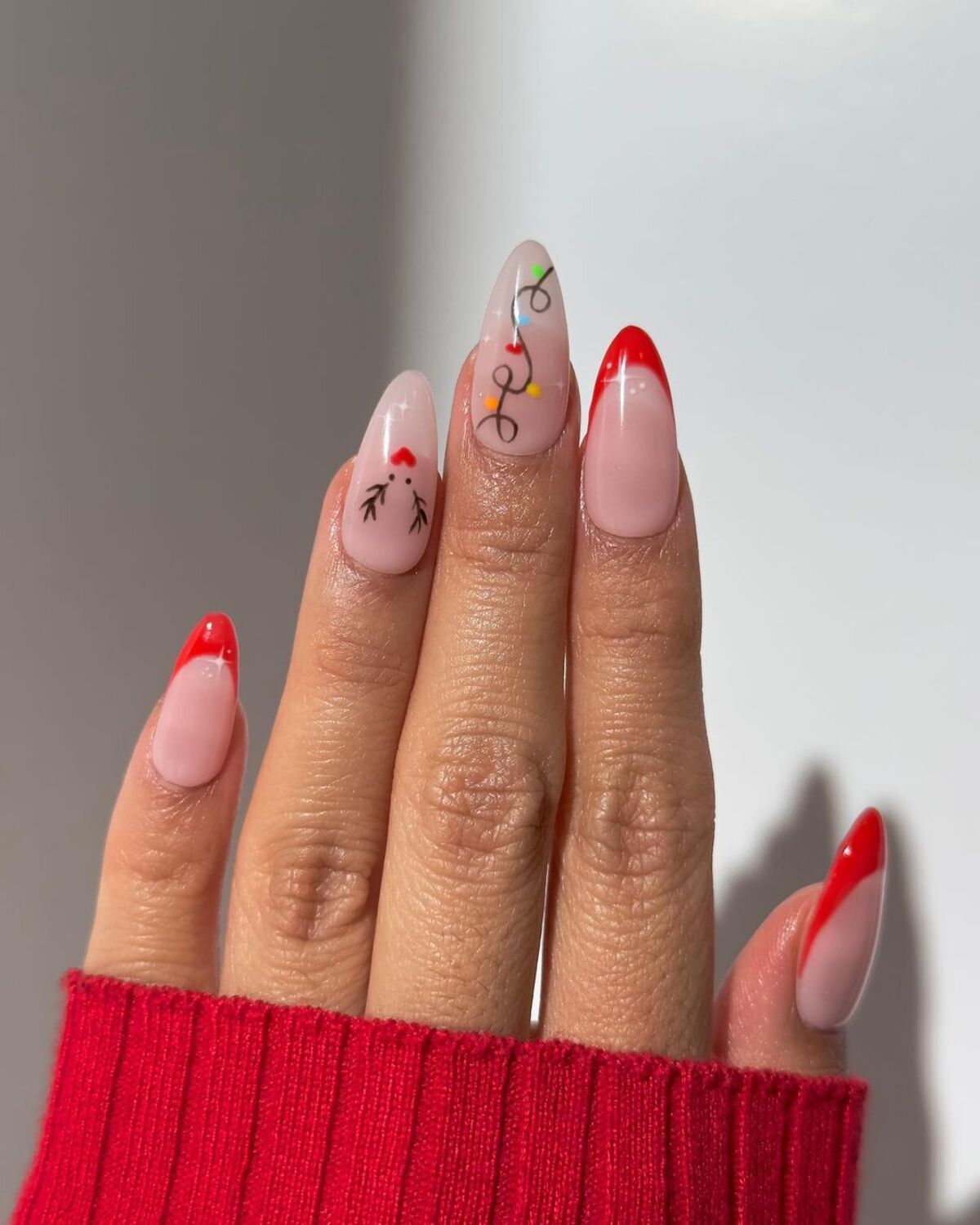 26. Red French Tips with Holiday Accents