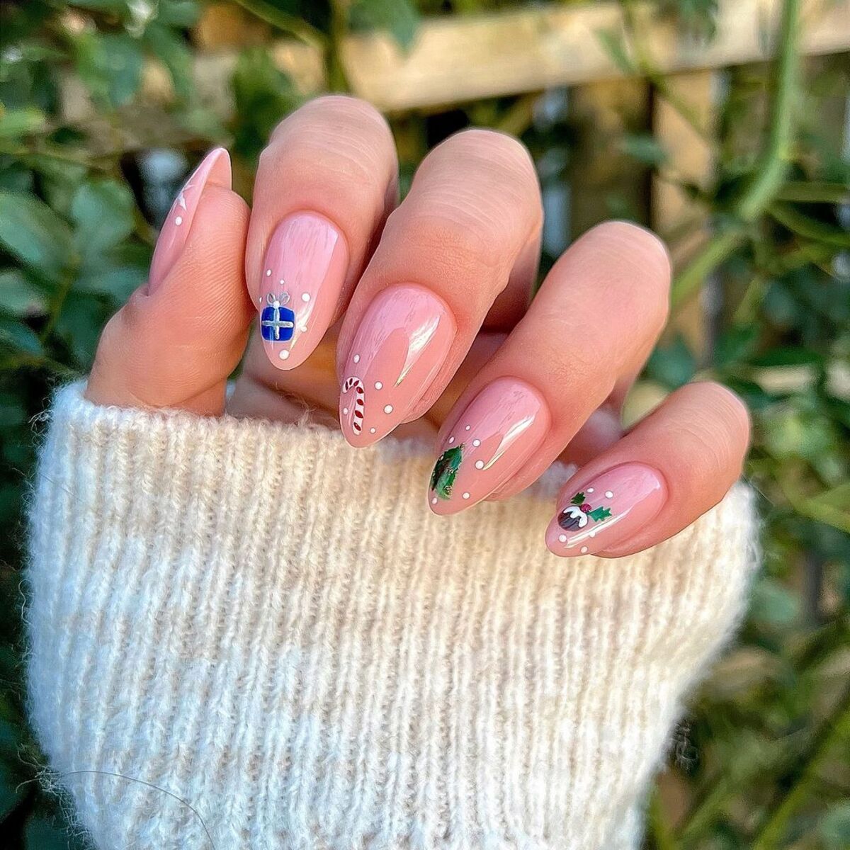 7. Whimsical Christmas Icons on Nude Nails