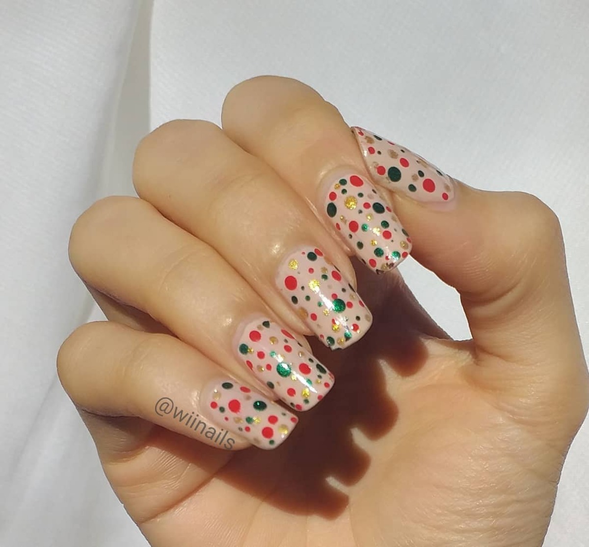 11. Festive Confetti Nails with Green and Red Dots