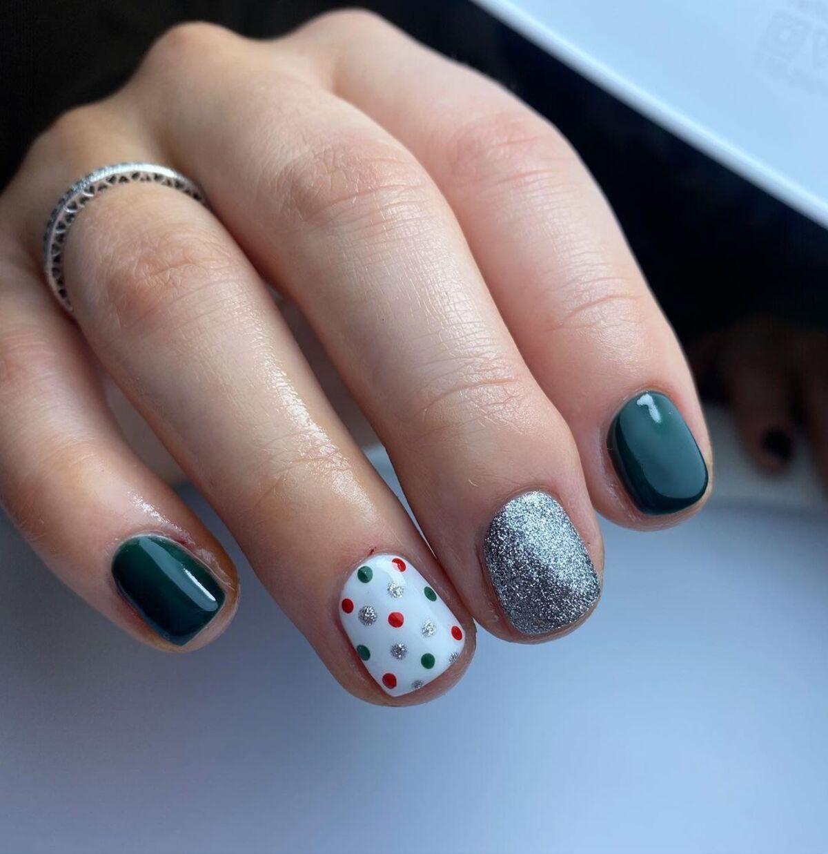 15. Bold Green and Silver Festive Nails