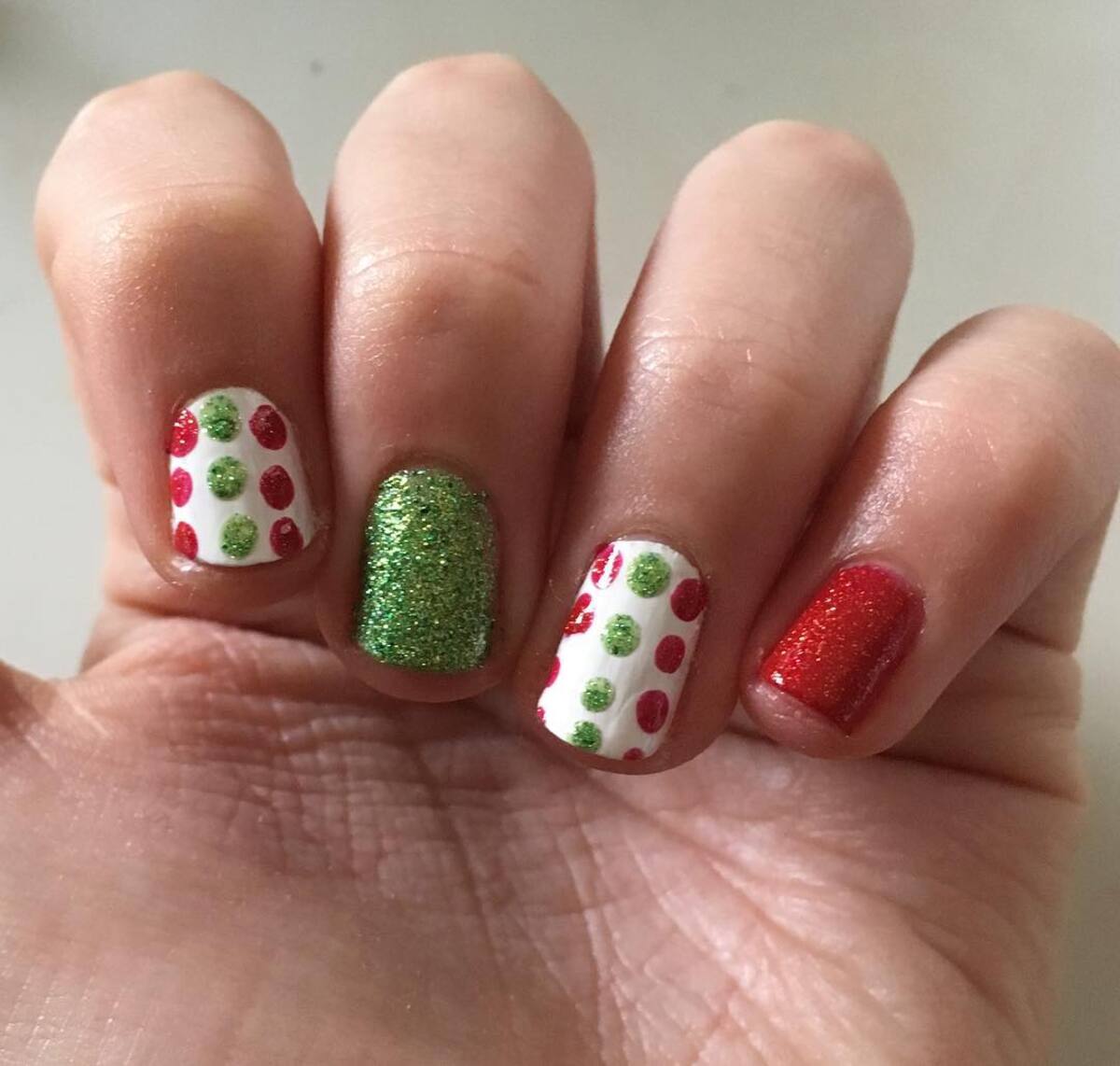 18. Glittery Green and Red Polka Dot Nails