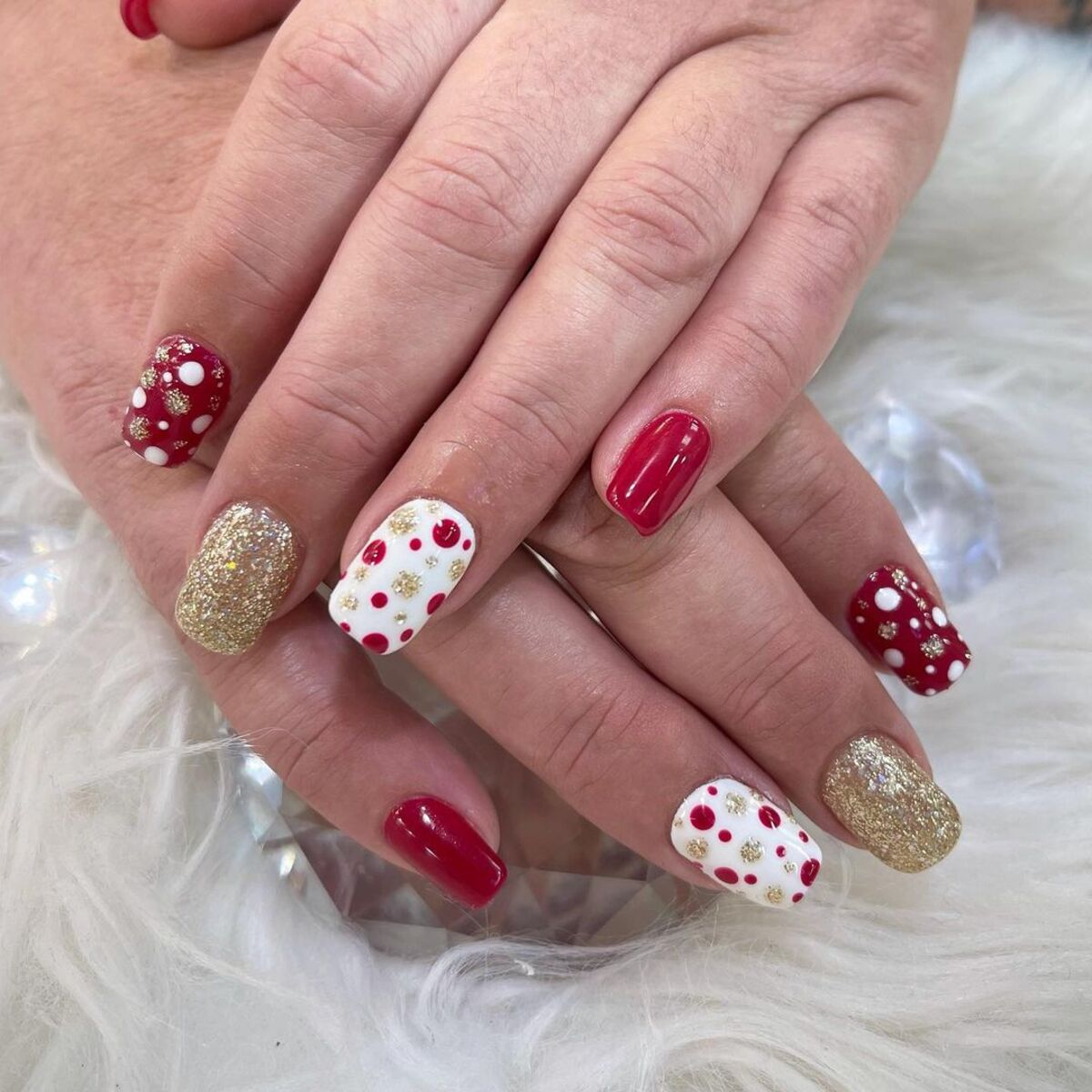 24. Gold Glitter and Polka Dot Holiday Nails