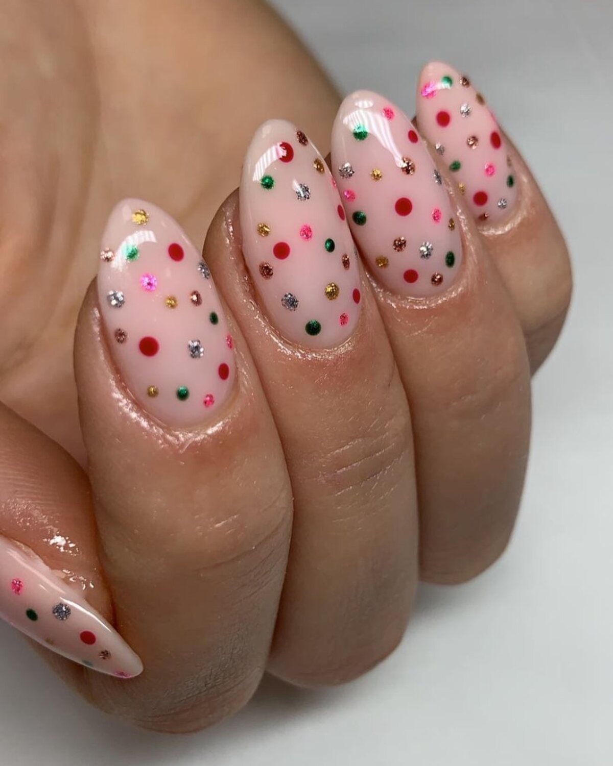 3. Glittering Rainbow Polka Dots on Soft Pink