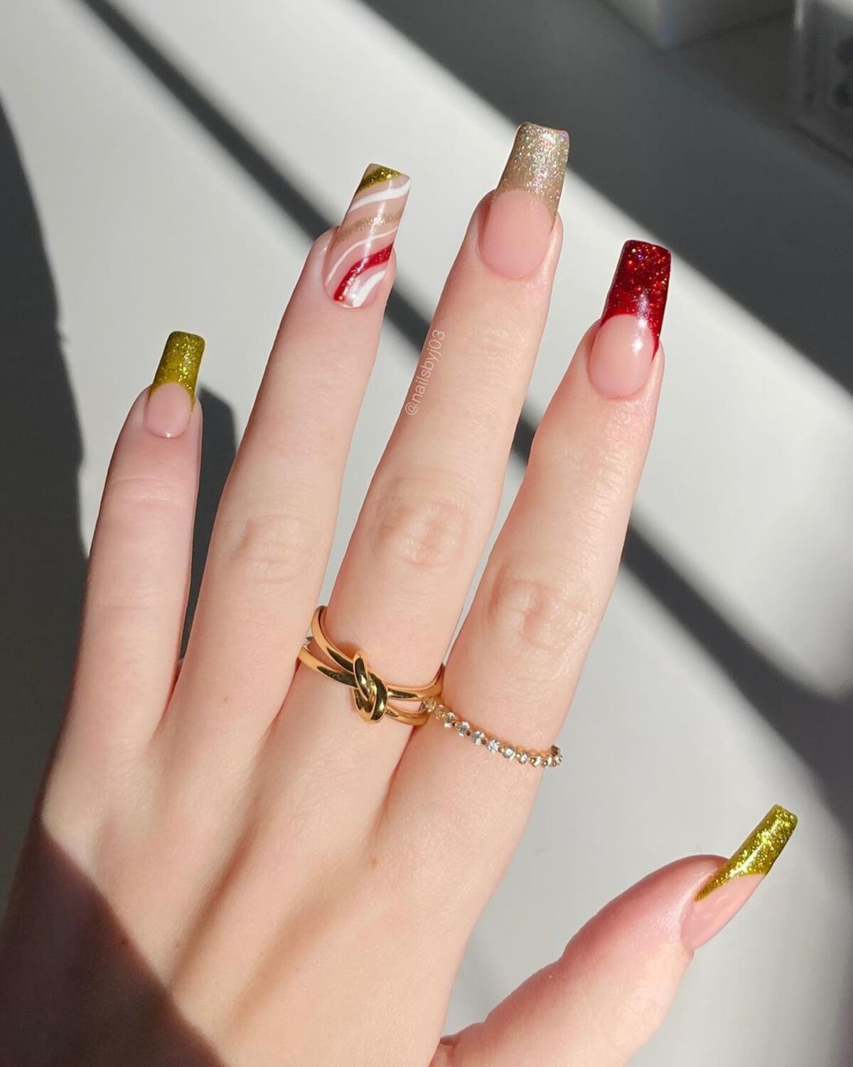 1. Sparkling French Tips with a Festive Twist