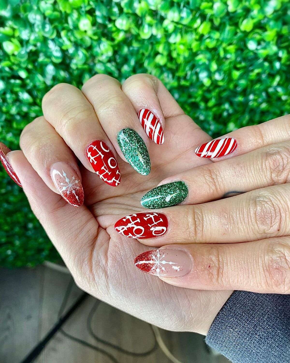 15. Glittery Green and Red 'Ho Ho Ho' Nails