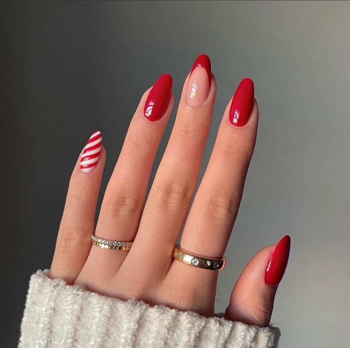 3. Bold Red Almond Nails with a Festive Twist