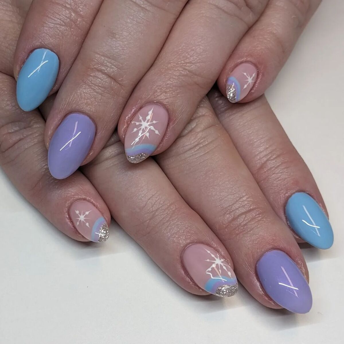 22. Pastel Blue and Lavender Snowflake Nails