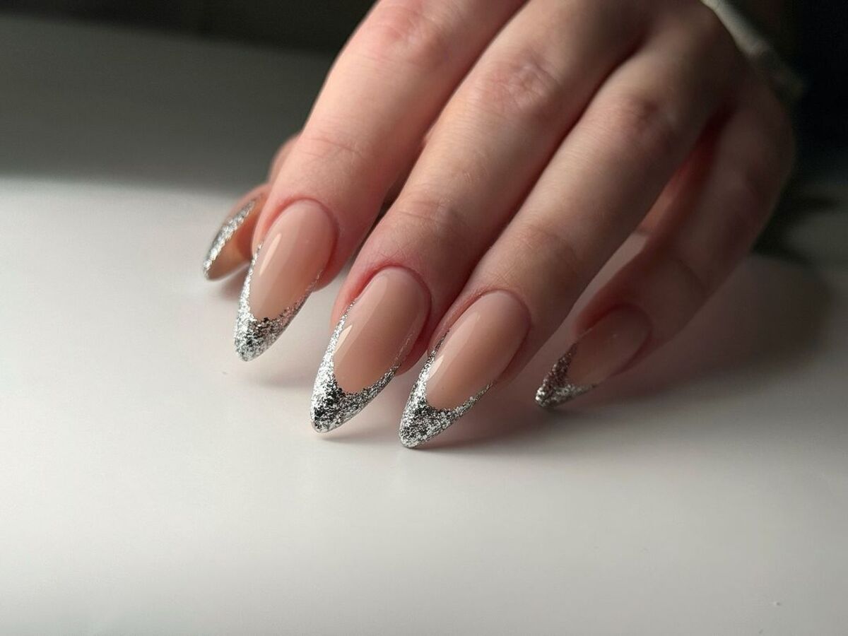 1. Silver Glitter French Tips for a Glam New Year’s Eve