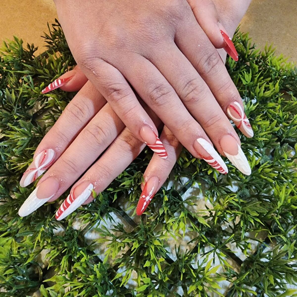 17. Candy Cane French Tips with Snowflake Accents