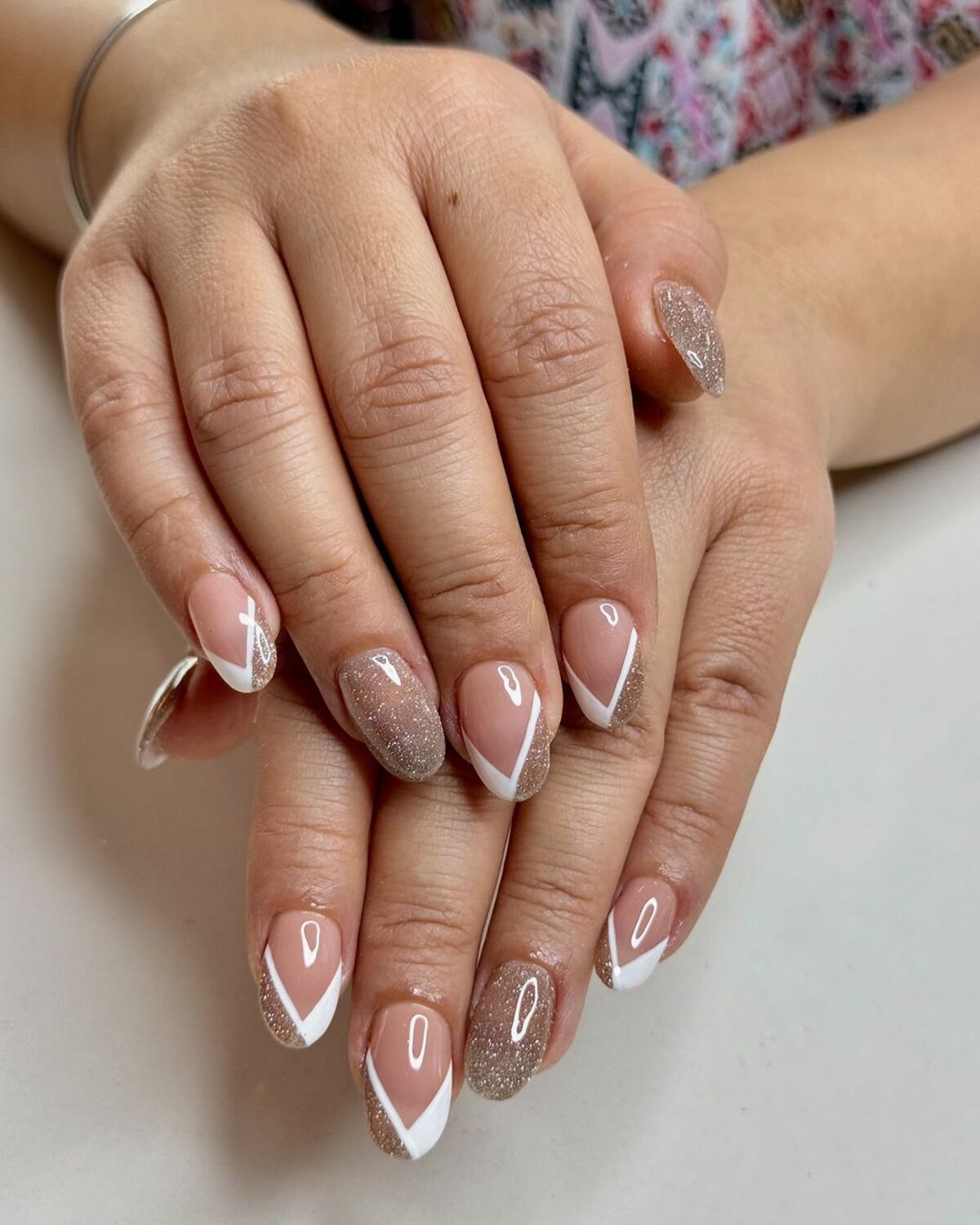 2. Classic French Tips with a Touch of Glitter