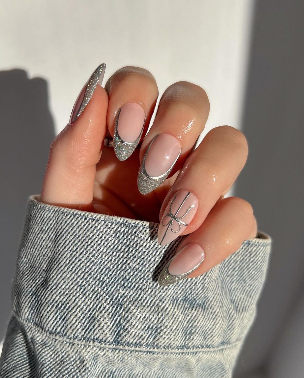 3. Elegant Silver French Tips with Bow Accent Nail