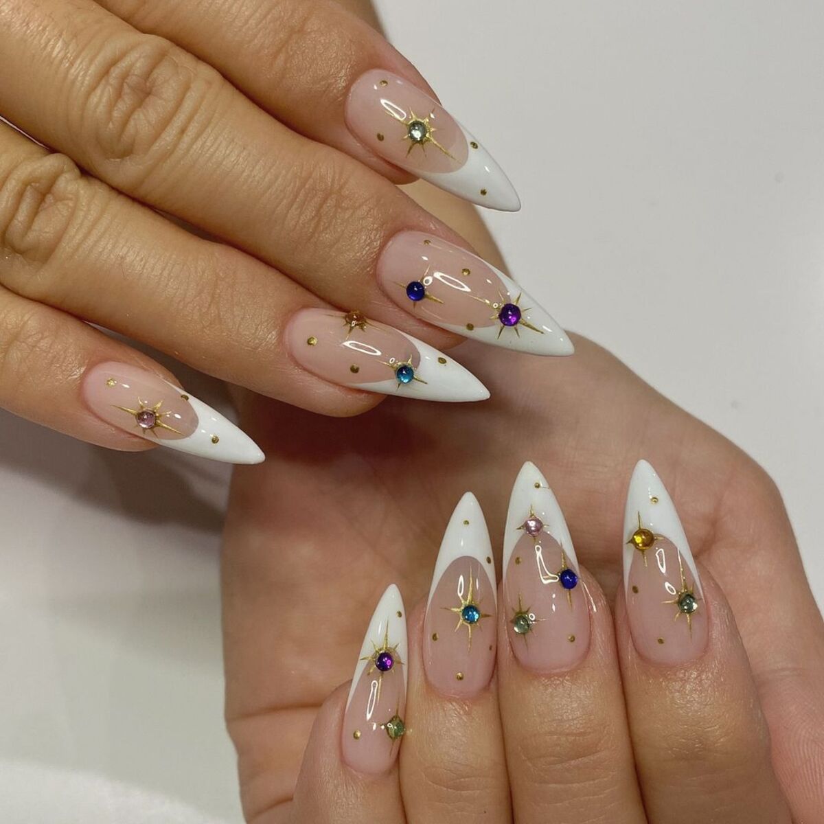 4. Gem-Studded French Tips for a Festive Pop