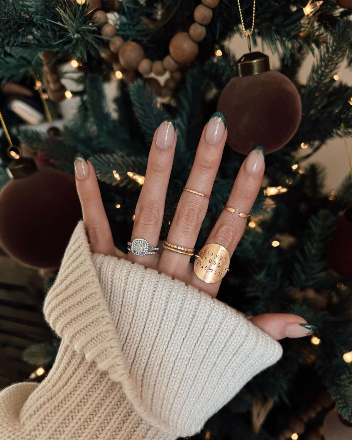 6. Forest Green French Tips with Golden Bow Detail