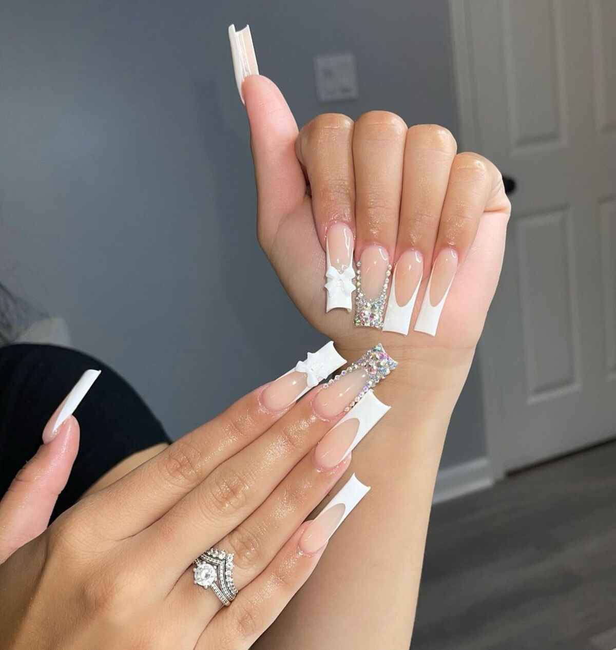 7. Luxe French Tips with Rhinestone and Pearl Accents