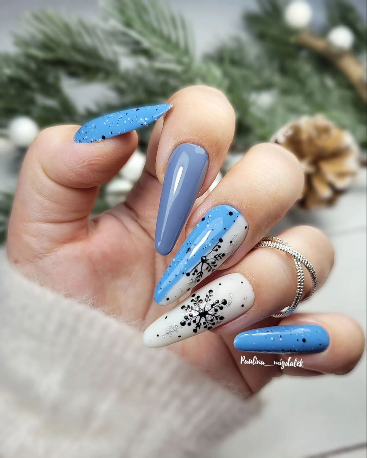 24. Frosty Blue and White Snowflake Nails