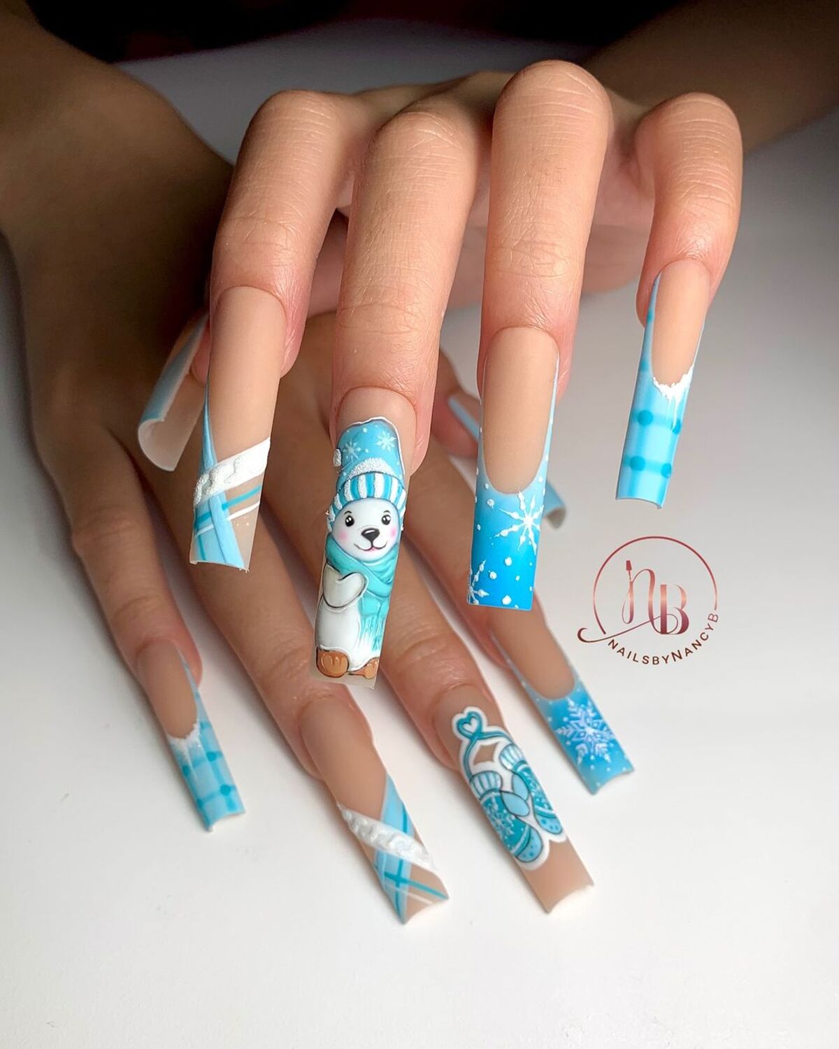 25. Playful Polar Bear and Mittens Nail Art