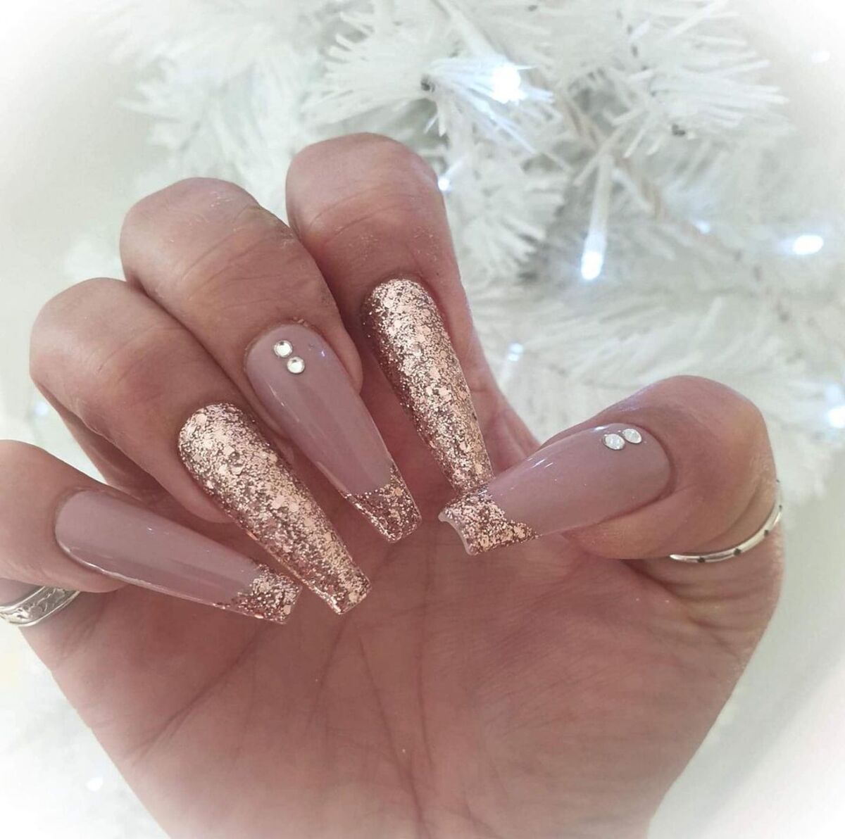 22. Rose Gold Glitter Tips with Rhinestone Elegance