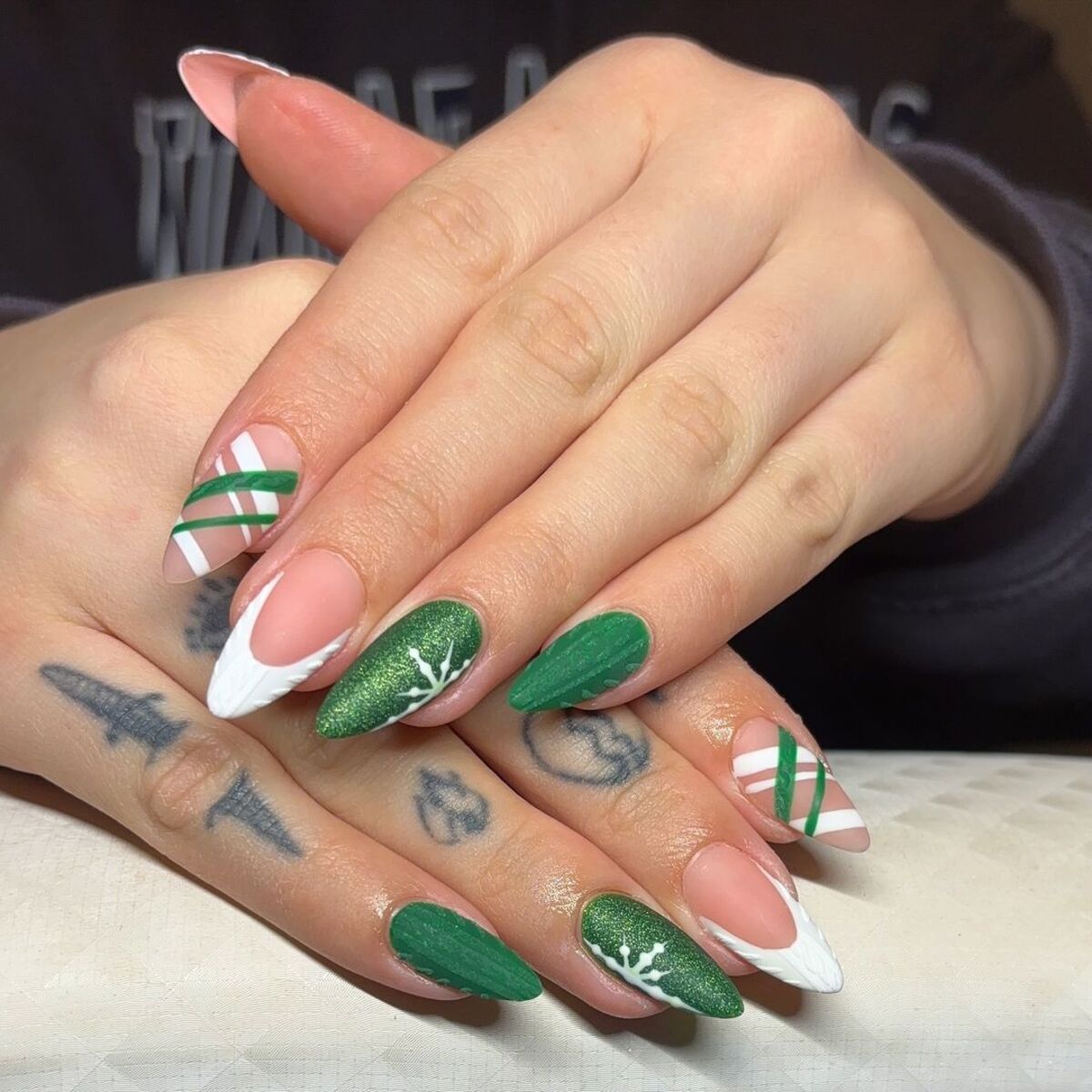 1. Elegant Green and White Holiday Nails