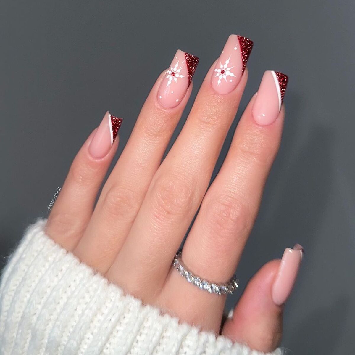 12. Elegant Red Glitter French Tips with Snowflake Accents