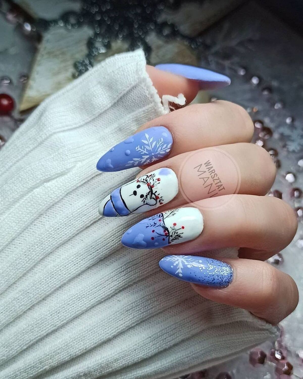 13. Whimsical Snowman and Snowflake Nail Art