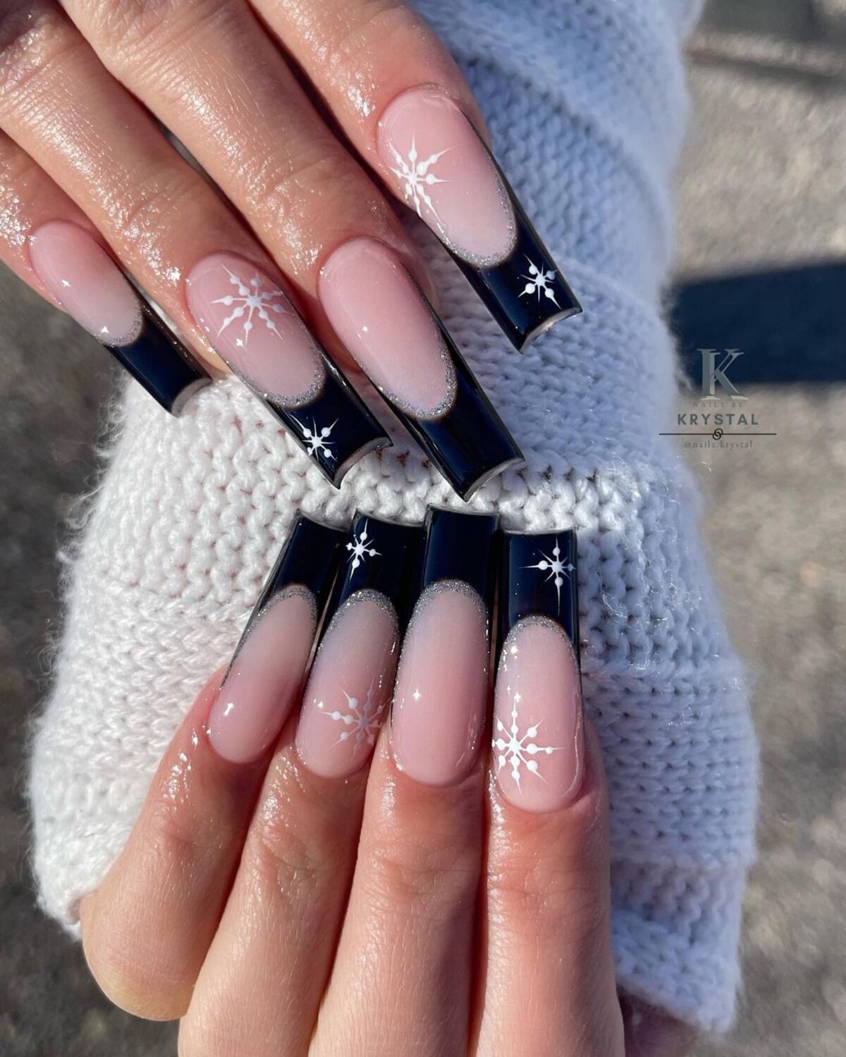 19. Black French Tips with Delicate Snowflakes