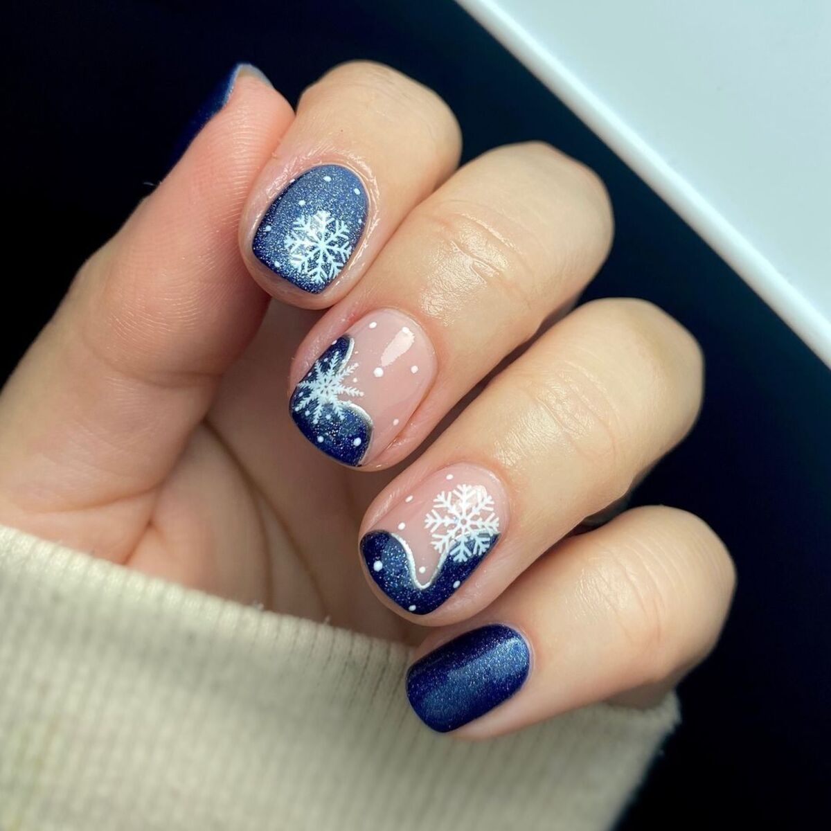 9. Midnight Blue Winter Snowflake Nails