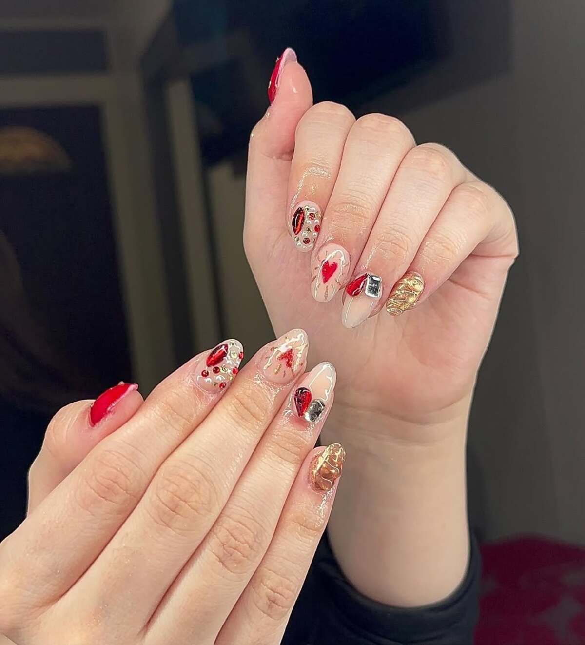 15. Artistic Red and Gold Nail Collage