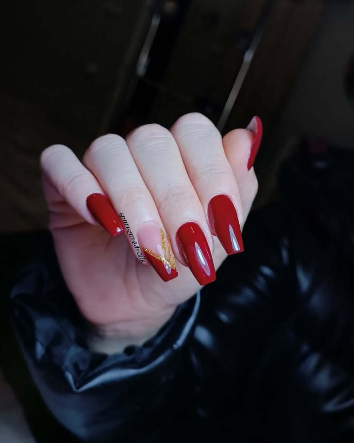 18. Glossy Red Elegance with Subtle Gold Leaf