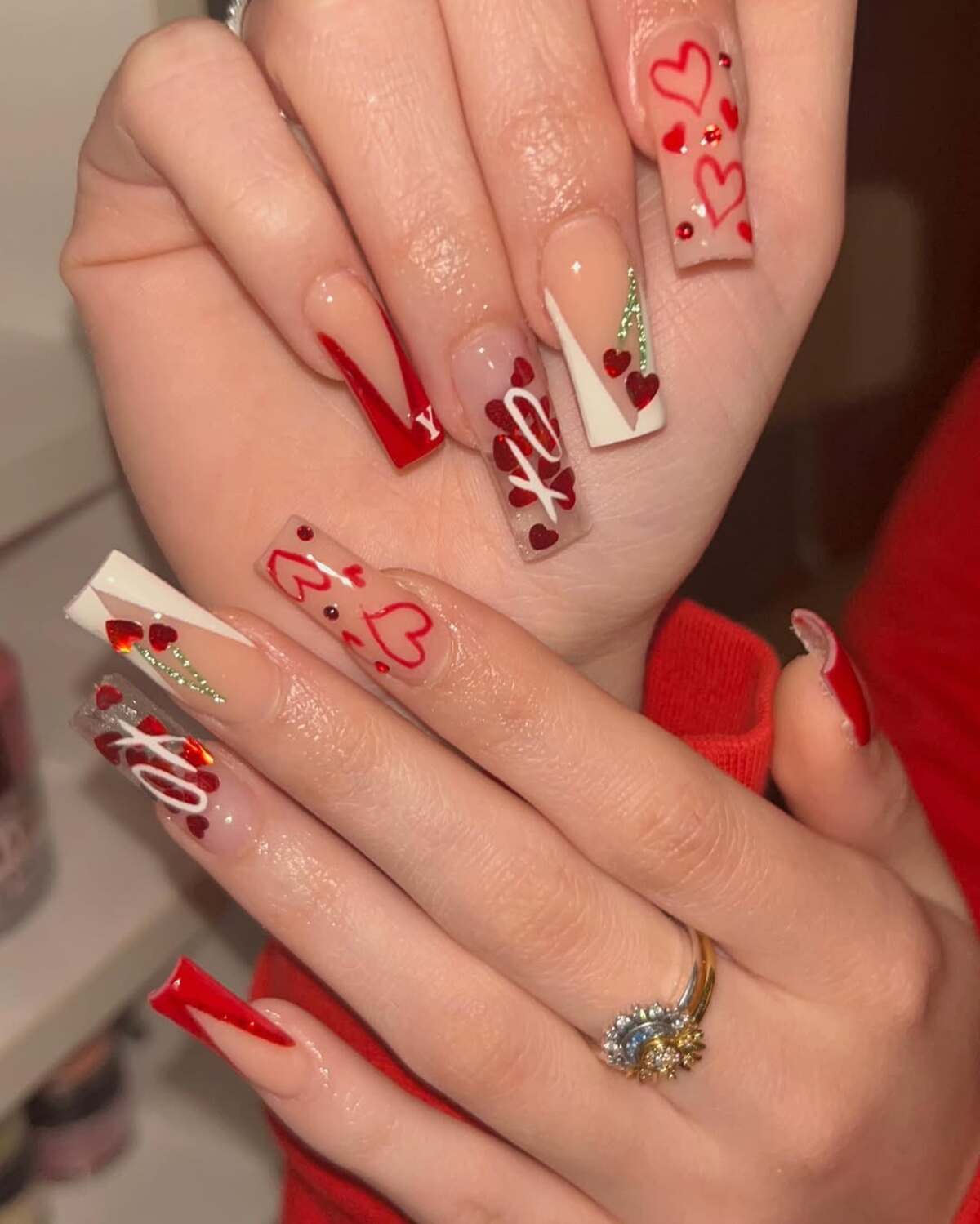 7. Bold and Geometric Red & Gold Coffin Nails