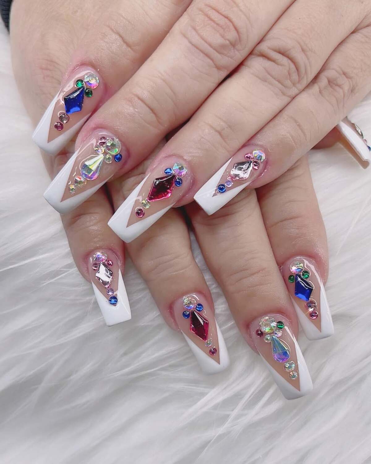 23. Colorful Rhinestone Accents on French Tips