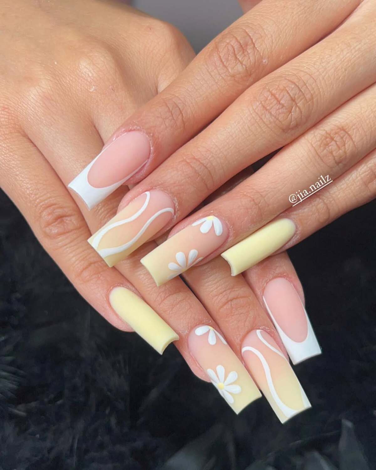 1. Whimsical Daisy French Tips with Yellow Accents