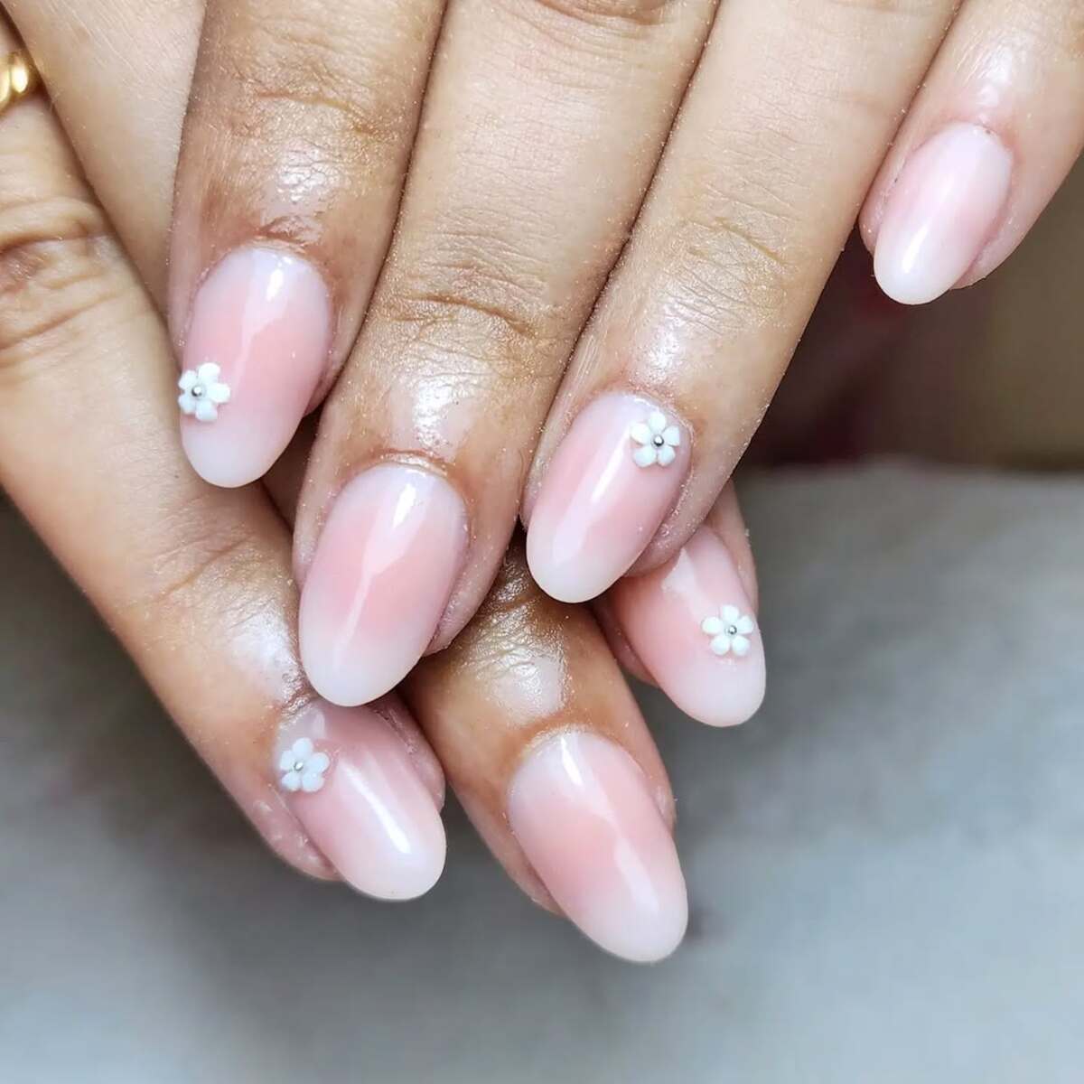 15. Classic Nude French Tips with Miniature Florals