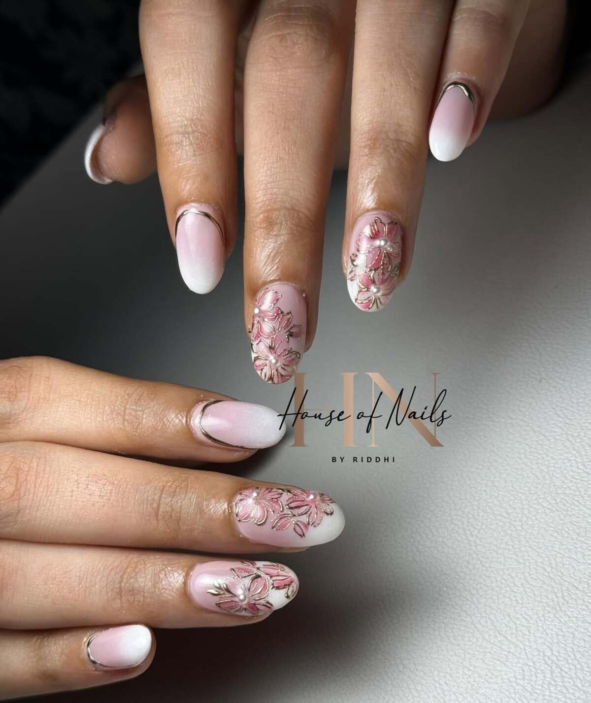 20. Elegant Floral French Tips with Metallic Details