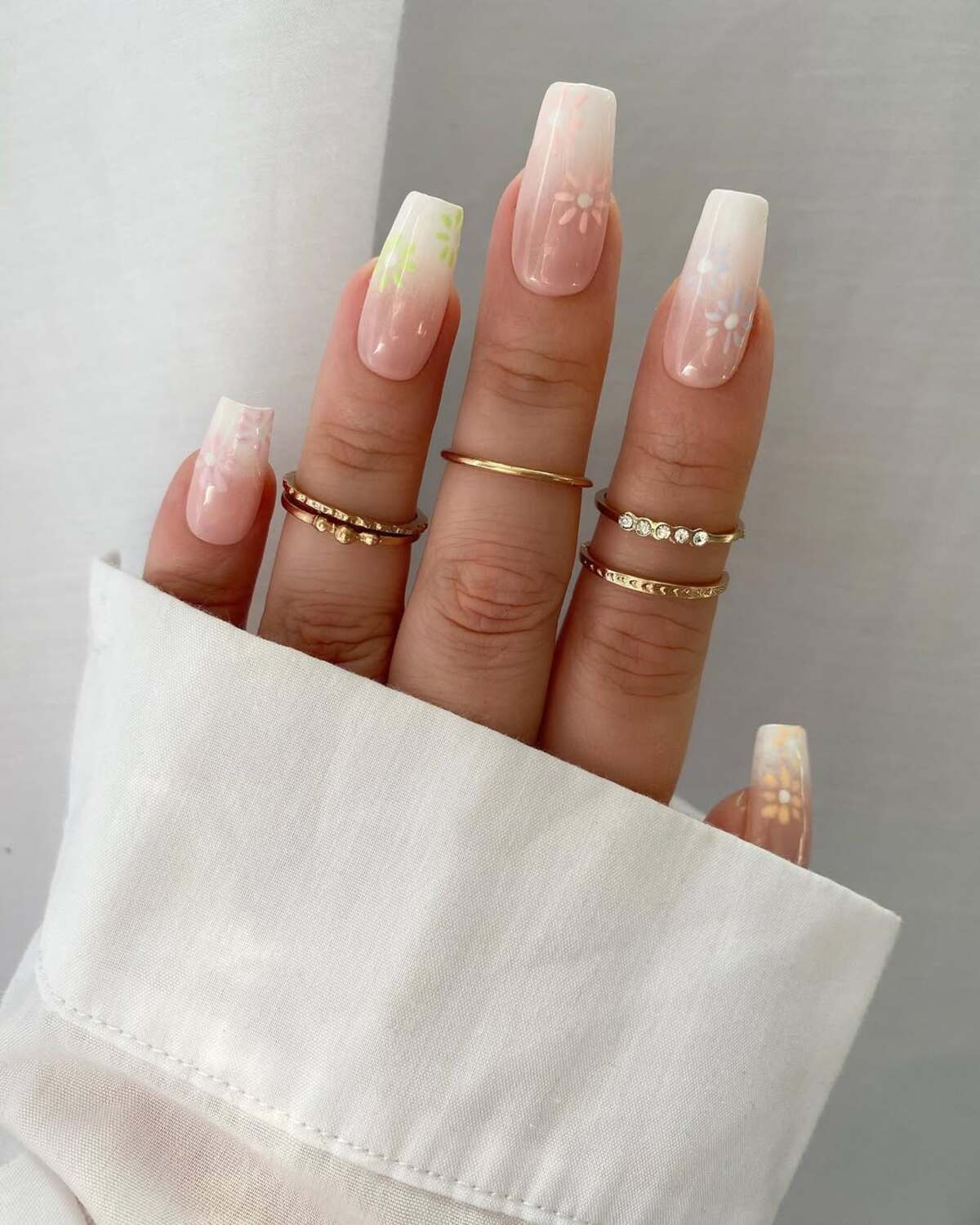 27. Minimalist Floral French Tips in Soft White