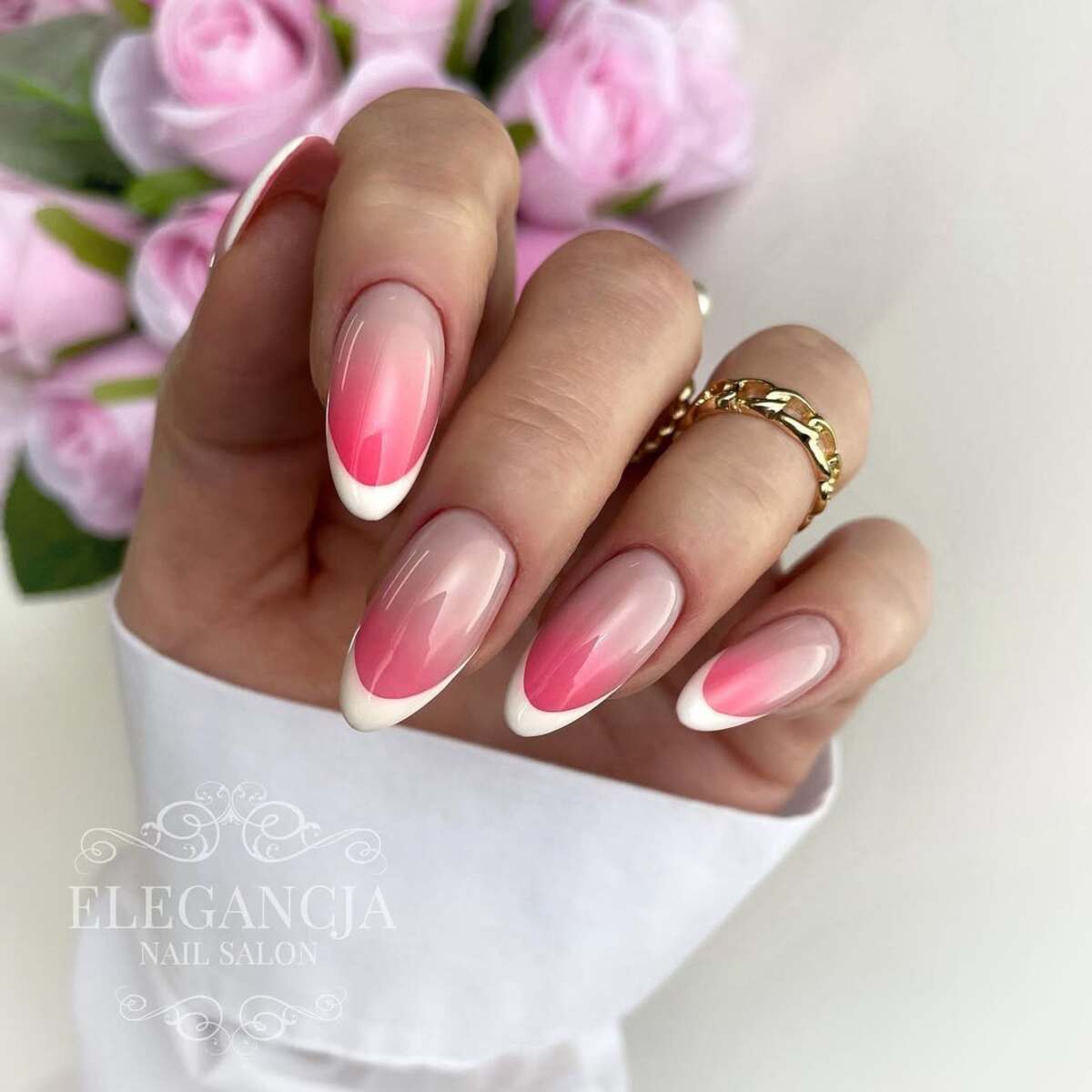 8. Gradient Pink and White French Tips with a Glossy Finish