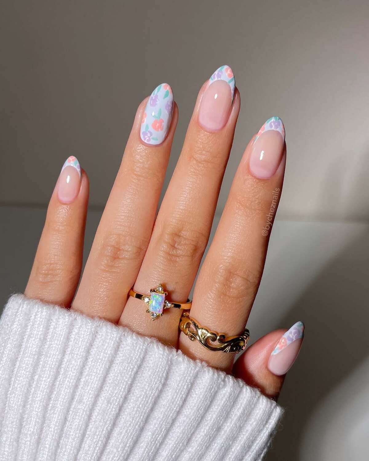 21. Floral French Tips in Pastel Tones