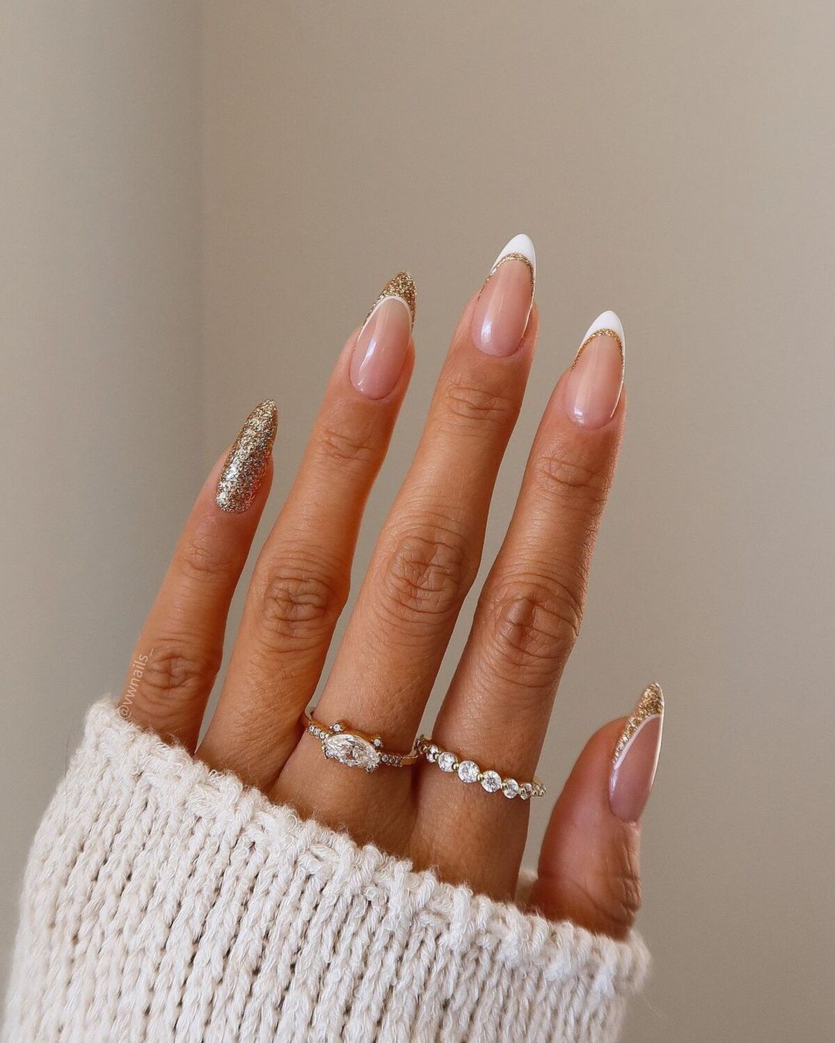 2. Glittery Gold French Tips with a Modern Twist