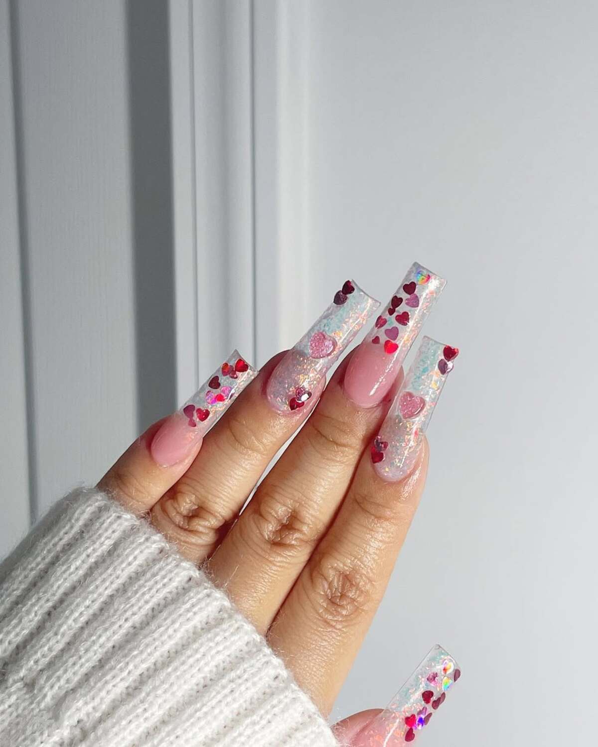 1. Glittering Pink Coffin Nails with Floating Hearts