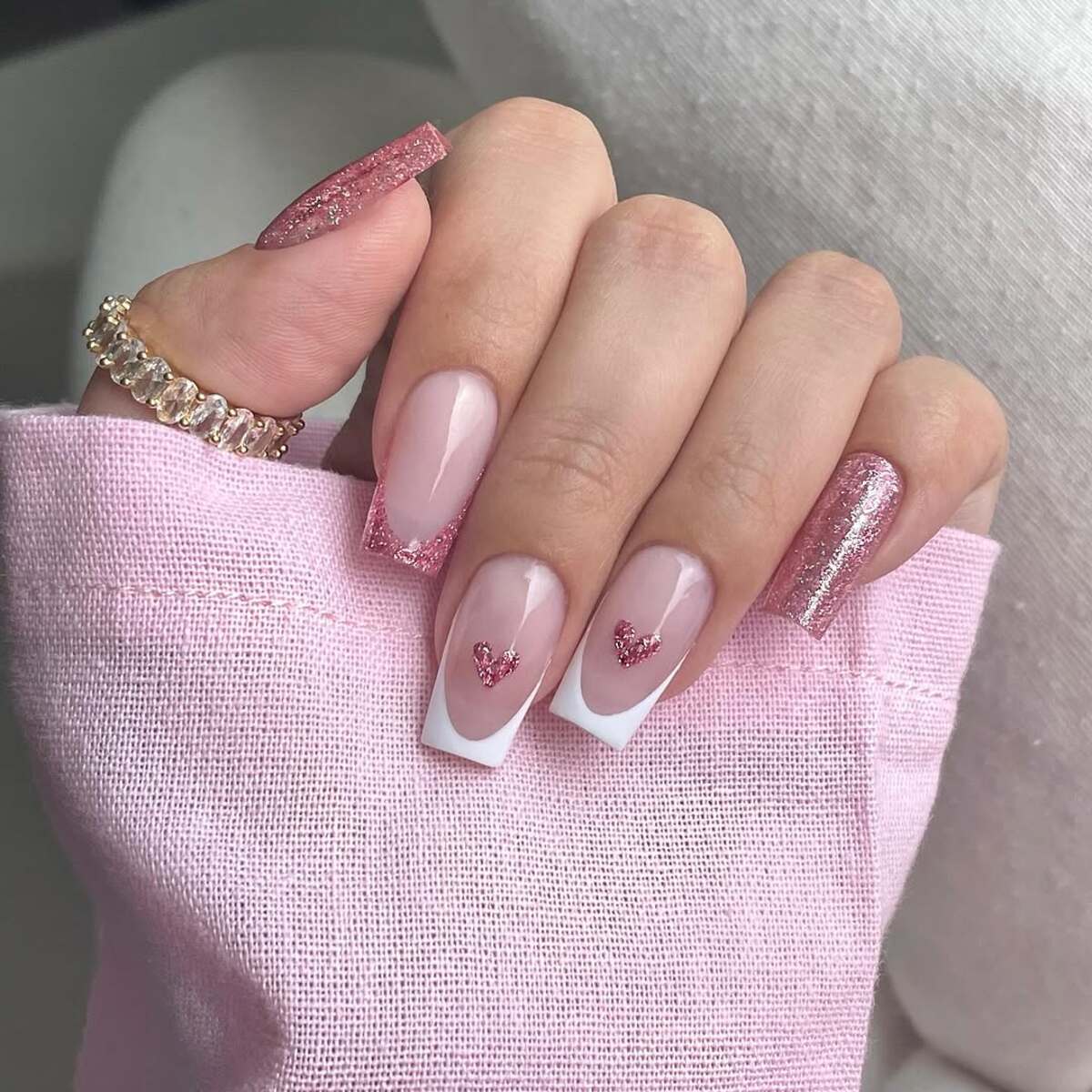 12. Classic French Tips with Glittery Heart Details