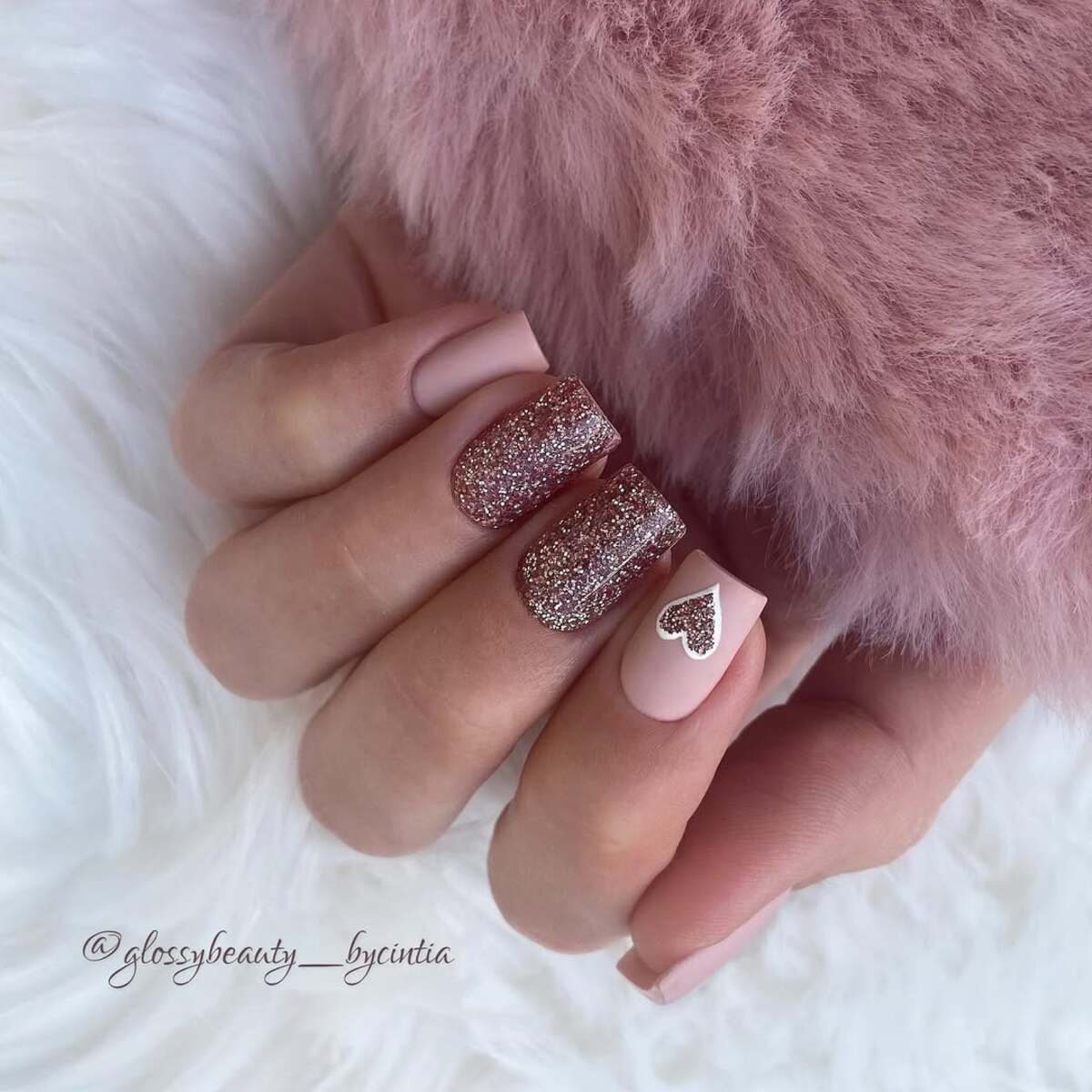 17. Rose Gold Glitter with a Delicate Heart Accent