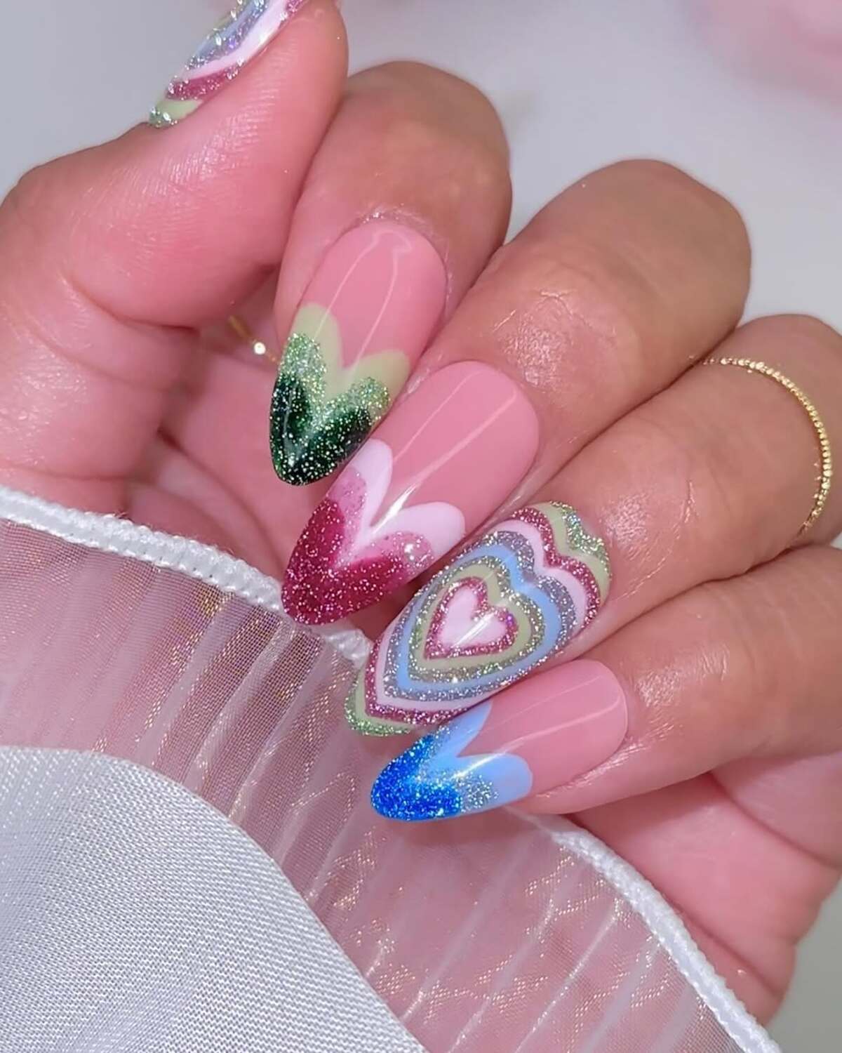 9. Vibrant Rainbow Heart Nail Art