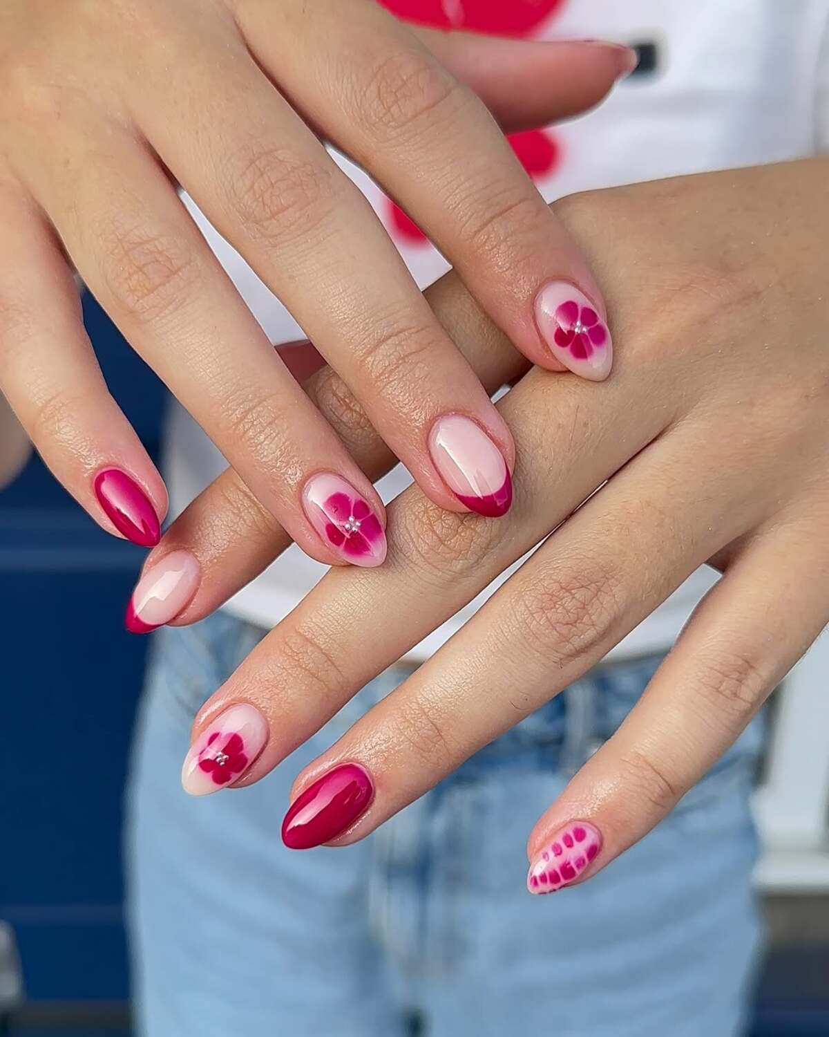 9. Berry-Toned Blossoms with Minimalist French Tips