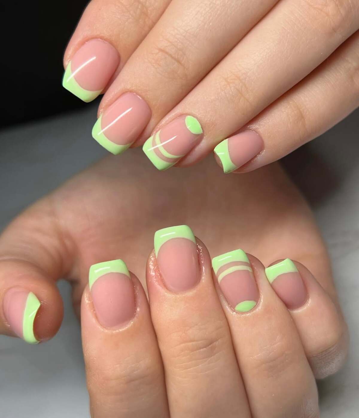 15. Modern French Tips with Pastel Green Accents