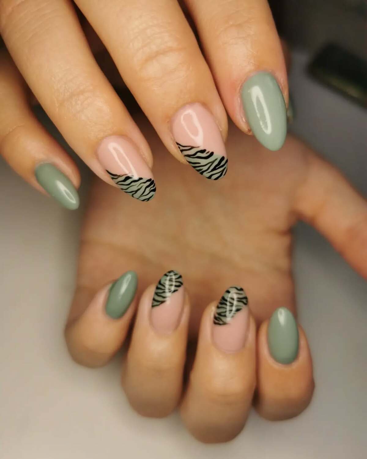 20. Animal Print on a Soft Green Palette