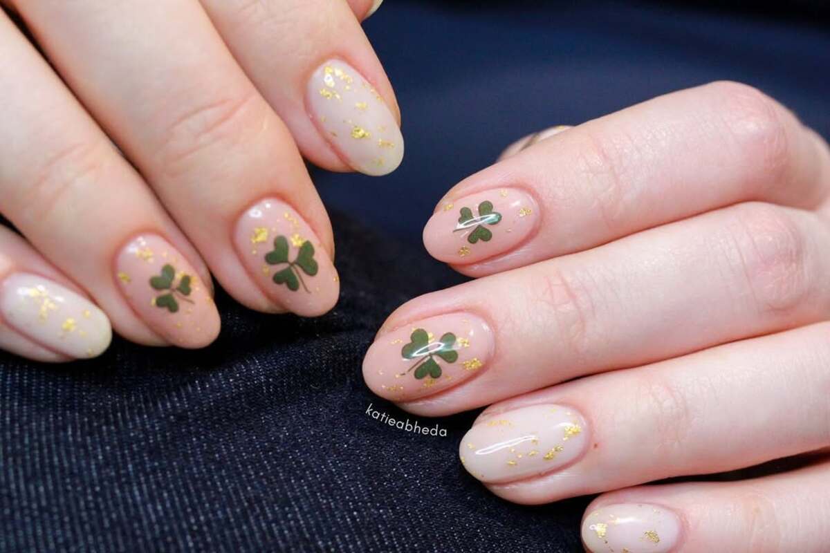 5. Delicate Gold-Flecked Shamrock Nails